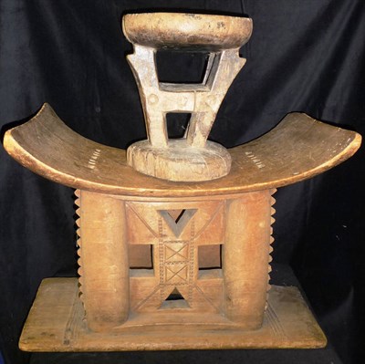 Lot 293 - An Ashante Wood Chief's Stool, carved from a single block of wood, with curved rectangular seat, on