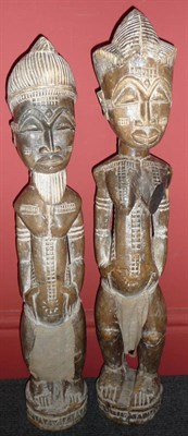 Lot 301 - A Pair of Baule, Ivory Coast Wood Ancestor Figures, of a man and a woman, each standing with combed