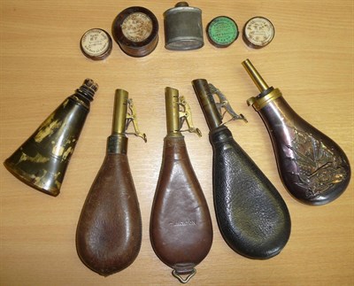 Lot 305 - A 19th Century Horn Powder Flask, of rounded triangular form, with cork stopper; Three Leather Shot