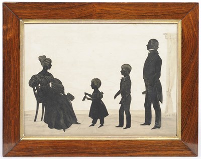 Lot 1077 - A Silhouette Cut-Out Family Group, circa 1840, depicting a mother seated in a chair holding a book