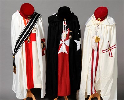 Lot 49 - Regalia to The Order of Thomas of Acon, comprising tunic, mantle and red velvet cap; Regalia to...