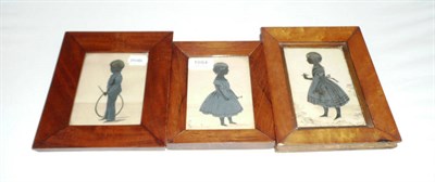 Lot 1084 - A Silhouette Cutout Profile Standing Portrait of a Young Girl, circa 1840, standing holding a...