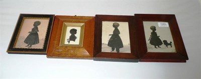 Lot 1085 - A Silhouette Cutout Standing Portrait of a Child and Pet Dog, circa 1840, wearing a dress and...