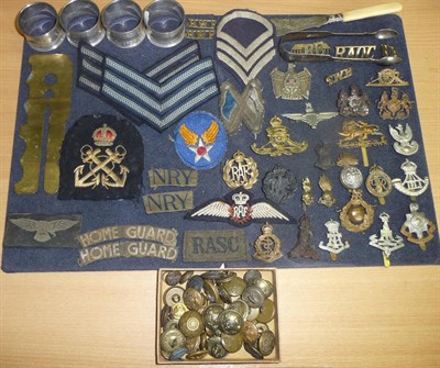 Lot 71 - A Collection of Militaria including twenty one cap badges in mainly brass, white metal and...