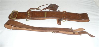 Lot 75 - An Army Officer's Sam Browne, with brass mounts and buckles, together with a stitched leather sword