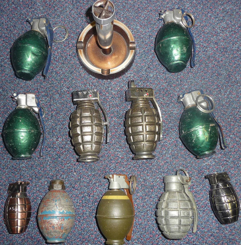 Lot 102 - Seven Drill Practise Hand Grenades, inert, and four cigarette lighters modelled as hand...