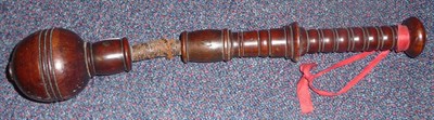 Lot 113 - A 19th Century Walnut "Life Preserver" Truncheon, the ring turned globular head on a leather...