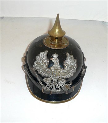 Lot 115 - A Prussian Ersatz Tin Pickelhaube, with stamped brass helmet plate, folded brass rim to the...