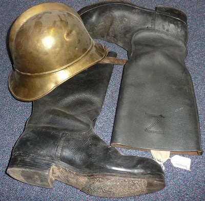 Lot 120 - A Brass Adrian Helmet, with folded rim, leather liner and chin strap; a Pair of Black Leather...