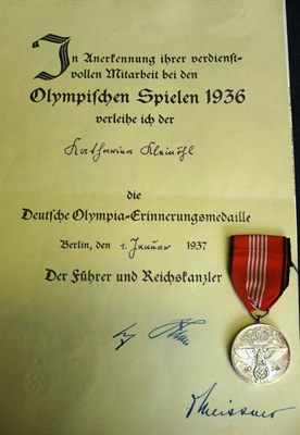 Lot 134 - A German Third Reich 1936 Olympic Commemorative Medal, with ribbon and certificate awarded to...