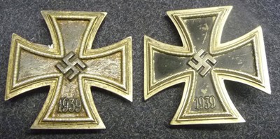 Lot 143 - A German Third Reich Iron Cross, 1st Class, the sword shape pin stamped 26; another, the sword...