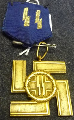 Lot 151 - A German Third Reich SS Long Service Cross in Gold, for twenty five years service, the blue...