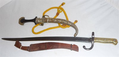 Lot 220 - A 19th Century Caucasian Kindjhal, with 23cm curved steel blade, ebonised wood grip and brass...