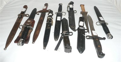 Lot 267 - A Spanish 1941 Bolo Bolo Bayonet, with Toledo blade, lacks scabbard; three Swiss Knife...