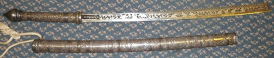 Lot 291 - A 19th Century Burmese Dha, the 56cm single edge clip point steel blade with niello type and inlaid