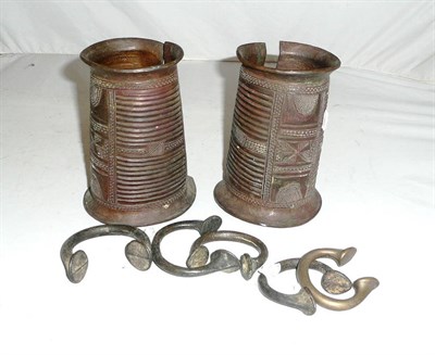 Lot 306 - A Pair of Benin Bronze Wrist Cuffs, of tapering cylindrical form, with flange rims, the bodies...