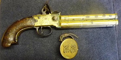 Lot 380 - A Late 18th/Early 19th Century Brass Four Barrel Tap Action Flintlock Pistol by Rea, London,...