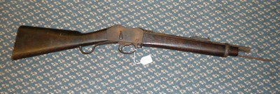 Lot 407 - A Victorian Martini Henry MK.II Rifle, the cut-down blued steel barrel with proof marks, the...