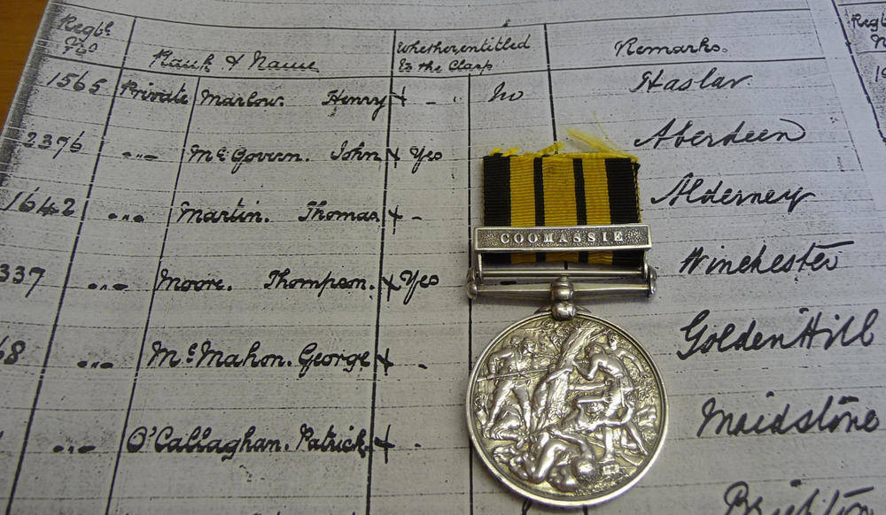 Lot 22 - An Ashantee Medal 1874, with clasp COOMASSIE, awarded to 2376. PTE.J.Mc.GOVERN. A.H.C. 1873-4.,...