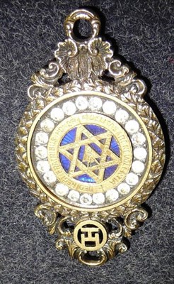 Lot 35 - A Victorian Silver Gilt Masonic Breast Jewel, with six point star on a blue enamelled ground within