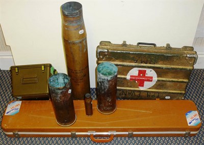 Lot 63 - Militaria, comprising four brass shell cases, a gun case, a First Aid case and a Medical...