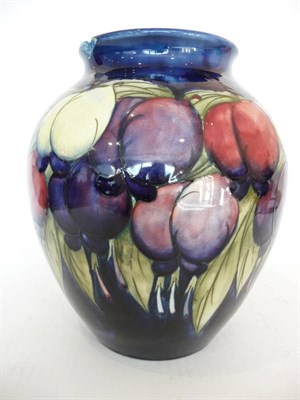 Lot 1127 - A William Moorcroft "Wisteria" Vase, on a dark blue ground, painted signature, impressed...