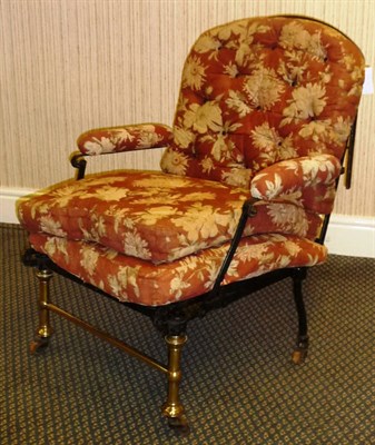 Lot 73 - An Early 19th Century Black Wrought Iron and Brass Campaign Bed/Chair, circa 1835, of three lattice