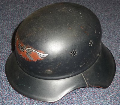 Lot 80 - A German Third Reich Luftshutz Helmet, of two piece Gladiator style, with folded rim, remains...