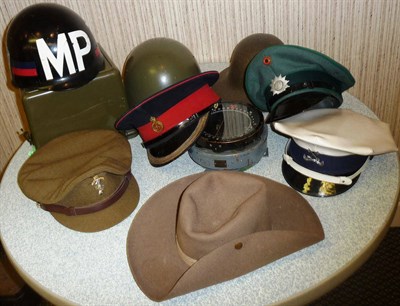 Lot 81 - A Peaked Cap to the Life Guards, a khaki peaked cap to REME, two other peaked caps, a Slouch...