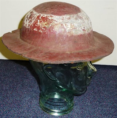 Lot 88 - A 19th Century Leather Hat, possibly Naval, painted red with a white band and narrow brim.