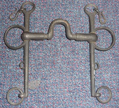 Lot 96 - A Steel Pelham Bit, with fixed high arched port, and curb chain hooks, lacks chain.