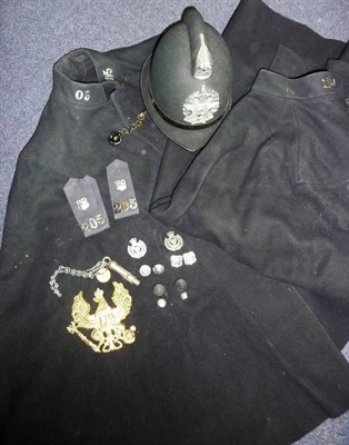 Lot 106 - A Leeds City Police Helmet, with two capes, a pair of shoulder epaulettes, badges and buttons,...