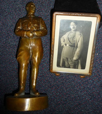 Lot 119 - A Hollow Brass Figure of Adolf Hitler, standing with his hands clasped before him, on a...