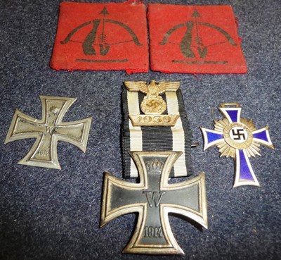 Lot 120 - A German 1914 Iron Cross, First Class, with 1939 spange; a German Mother's Cross, Silver class;...