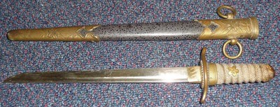 Lot 132 - A Second World War Japanese Naval Officer's Regulation Dirk, the 20cm single edge steel blade...