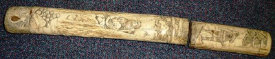 Lot 133 - The Carved Bone Hilt and Scabbard to a Japanese Tanto, well carved with warriors wielding clubs and