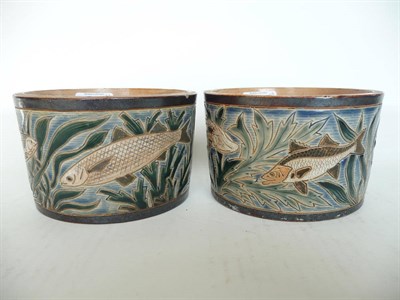 Lot 1140 - A Pair of Doulton Lambeth Stoneware Plant Pots, by Harry Barnard, decorated with fish amongst...