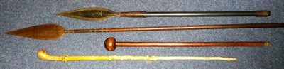 Lot 214 - A Zulu Knobkerrie, with small globular haft and tapered haft; a Masai Spear, with leaf shape...