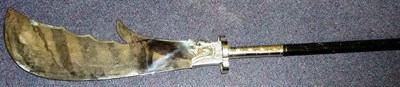 Lot 231 - A Chinese Polearm, the large chromium plated double spurred steel blade issuing from the head...