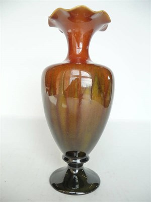 Lot 1145 - A Linthorpe Pottery Vase, shape No.2010, with frilly rim, brown, green and mustard glaze, impressed