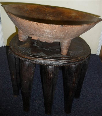 Lot 251 - A Fijian Wood Kava Bowl, of deep circular form with two fin shape handles, on four tapering...