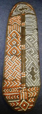 Lot 261 - A Congo Woven and Painted Wicker Shield, of oblong form, with bentwood frame,  decorated with...