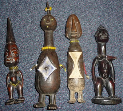 Lot 274 - A Collection of Four Ivory Coast Carved Wood Figures, two with inset bead eyes and recessed...