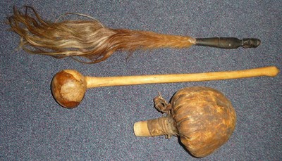 Lot 276 - A Zulu Knobkerrie, with offset bulbous head; a Masai Hide Flask, of gourd form, with wood...