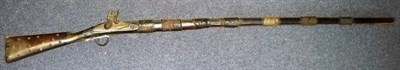 Lot 362 - A 19th Century Indian Flintlock Long Gun, made from composite parts, the 129cm steel barrel...