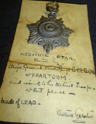 Lot 27 - A General Gordon's Star for the Siege of Khartoum, (possibly a copy) in pewter, mounted on a...