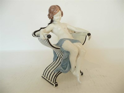 Lot 1164 - A Goldscheider Figure of a Nude Young Girl, by Polter, circa 1914, Model No.4130, perched on...