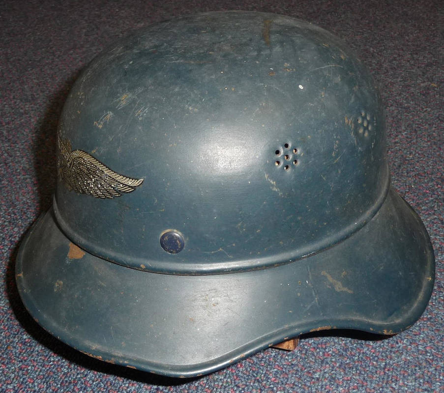 Lot 89 - A German Third Reich Luftshutz Helmet, of two piece Gladiator style, with leather liner, the...