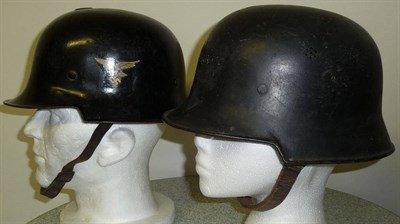 Lot 94 - A German Third Reich Civic Fire Helmet, the skull with two slits, with later Luftwaffe decal...