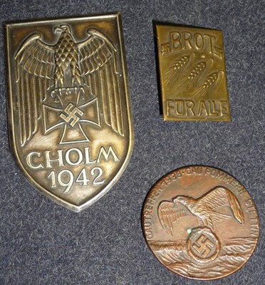 Lot 107 - A Cholm 1942 Shield, two pins detached, (possibly a copy); a Gautreffen 1938 Gau Pommern...